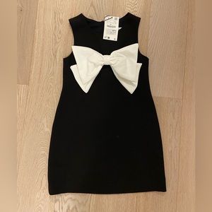 New with tags. Black dress with white bow